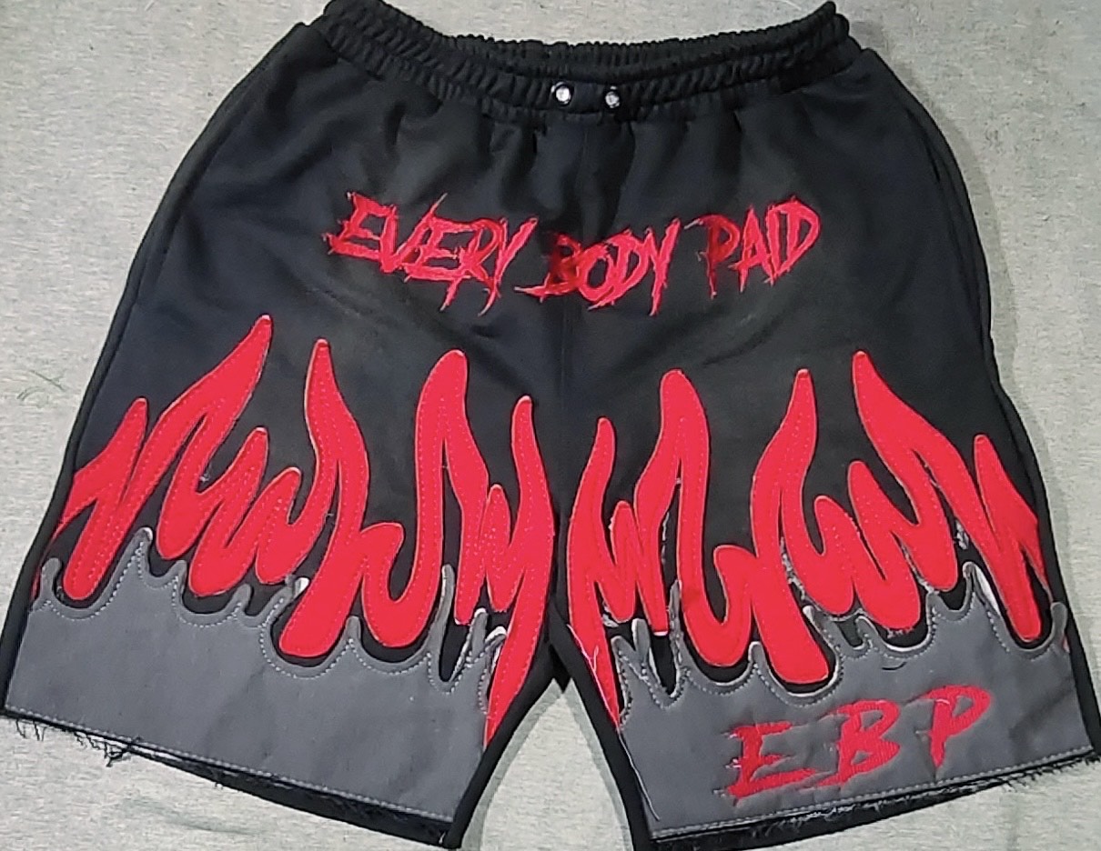 black Everybody Paid shorts with red flames