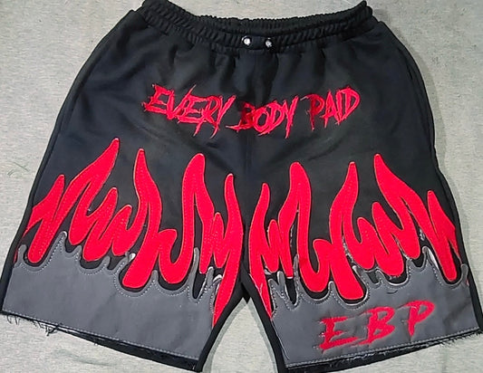 black Everybody Paid shorts with red flames